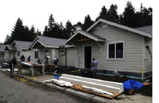 Sailors from the USS Kitty Hawk volunteered to work on three homes in Bremerton for Habitat for Humanity of Kitsap County.