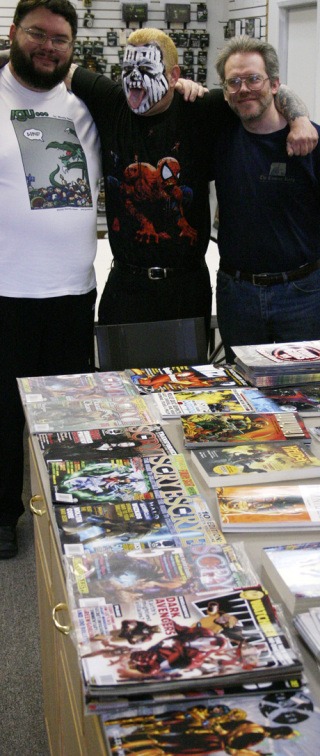 Ron 'The Iron Buddha' Sutherland (middle) with The Comics Keep owner Ash Limric (left) and store manager Dana Andrus (right) with less than half of the merchandise they've put together for Free Comic Book Day.