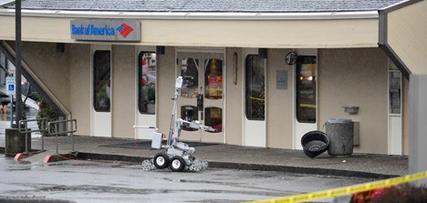 The Washington State Patrol used a robot to search for a possible explosive device in the Kingston Bank of America following a robbery and bomb threat Monday afternoon.