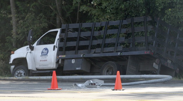 A truck knocked a light pole onto southbound State Route 305 Tuesday afternoon in Poulsbo.