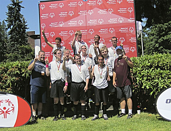 The South Kitsap Thunderbolts soccer team poses with their gold medals from the Special Olympics state tournament June 5 at Joint Base Lewis McChord near Tacoma. Front row: Coach Tim Wright