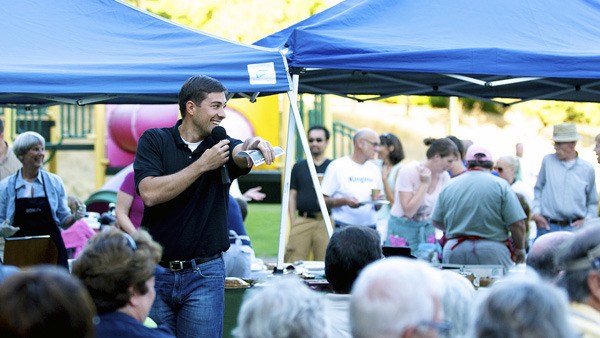 Kingston Rotary Club President Clint Boxman auctioned more than 60 pies at the third annual Pie in the Park fundraiser.