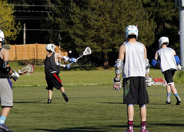 Members of the North Kitsap lacrosse team work in getting their defense and offense to “click” during practice on April 20. They were preparing for a match against Olympia