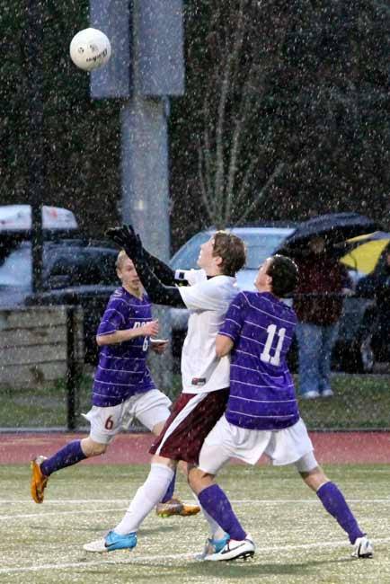 Kingston's Nick Boles prepares to head the soccer ball during the game against the North Kitsap Vikings March 19 at Buc Field. The Vikings won 6-1.