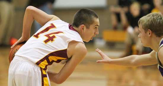 Kingston’s KT Deam looks for an opening in Sequim’s defense Tuesday night during home court action.  The Bucs varsity basketball team looks to increase their lead in the Olympic League tonight against Port Angeles.