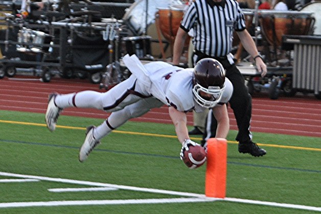 South Kitsap senior Bryce Broome scored three touchdowns and intercepted quarterback Isaac Dotson with about 30 seconds remaining to secure the Wolves’ 33-27 win Friday at Newport.