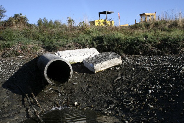 A joint Kitsap County and Suquamish Tribe project will replace an 18-inch diameter culvert with a larger box structure to improve water flow into an estuary on Miller Bay.