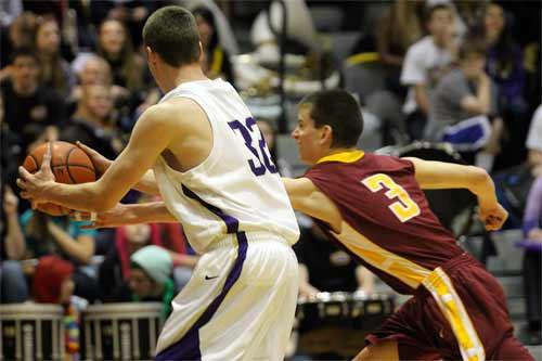 Kingston's Cody Combs attempts a steal against North Kitsap Jan. 13 at the North Kitsap High School Gymnasium. Kingston and North Kitsap will meet again during the last game of the regular season Feb. 7.