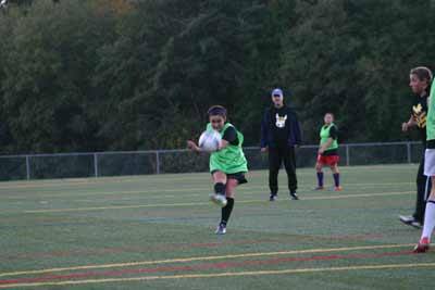 Players on the North Kitsap High girls soccer team practice Nov. 2 at Strawberry Field.