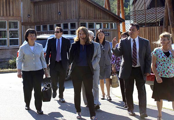 Port Gamble S'Klallam Chairman Jeromy Sullivan leads U.S. Health and Human Services Secretary Sylvia Burwell and others on a tour at Little Boston