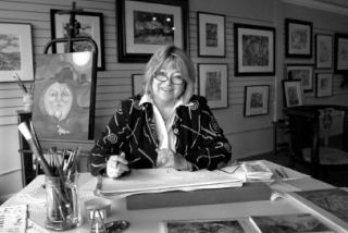 The Twisted Brush owner and artist-in-action Terry Christensen creates hidden image in her working studio and gallery on Front Street.