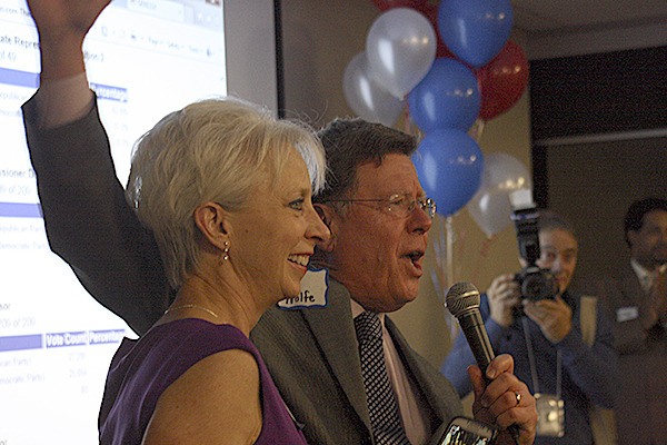 Republican county commission candidate Ed Wolfe celebrates early election returns Tuesday night. Wolfe is leading incumbent commissioner Linda Streissguth