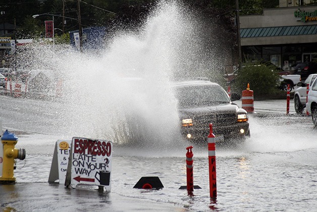 A late afternoon deluge Wednesday left a section of Silverdale Way near Bucklin Hill Road completely covered in water. The huge puddle led to some vehicles creating massive rooster tails and prompted several drivers to report the minor flooding to 911 dispatchers.