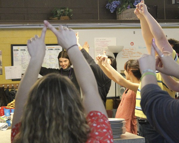 Students in Karen Johnston’s North Kitsap High School American Sign Language class and Susan Barrett’s Life Skills program sign to music May 29. Johnston’s ASL students have been helping Barrett’s learn sign language in preparation to a performance June 9 at the Christian Center in Poulsbo’s First Lutheran Church. The performance is part of a project started by the ASL students called “Signing for Change.”