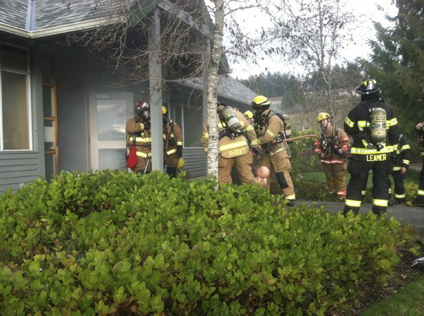 Area firefighters practice rescue techniques at the former Olympic Property Group office before it was demolished for Safeway.