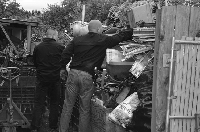 Investigators comb through metal scrap at a Gorst business.