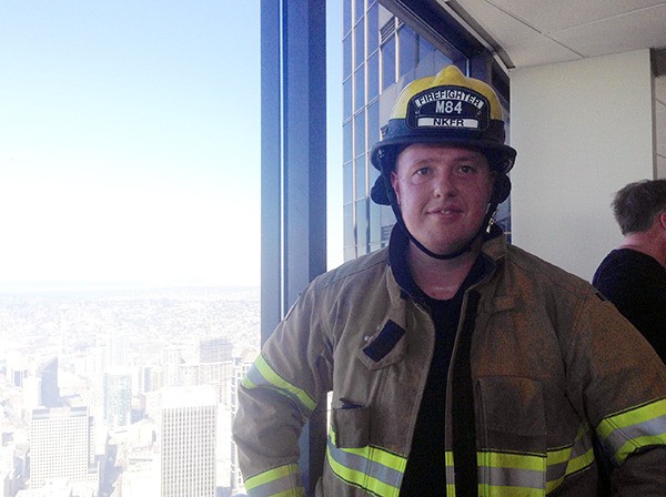 NKF&R firefighter/paramedic Craig Barnard at the top floor of Columbia Center