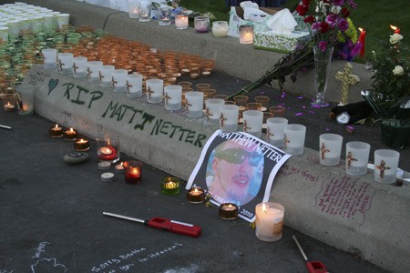 Matthew Netter’s memorial grew throughout Tuesday evening at the Bucklin Hill Road Timberland Bank where he was shot.