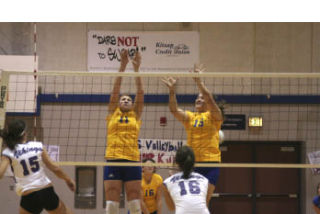 BHS’ Carly Erickson (11) goes up for a block during the Lady Knights’ 3-0 loss to North Kitsap at home Tuesday. It was the last match of the season for BHS.