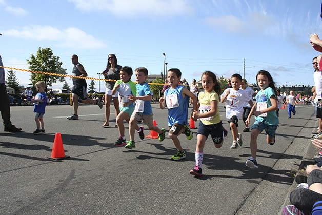 A group of young runners approach the finish line during the Whaling Days Kids' Dash in Silverdale.