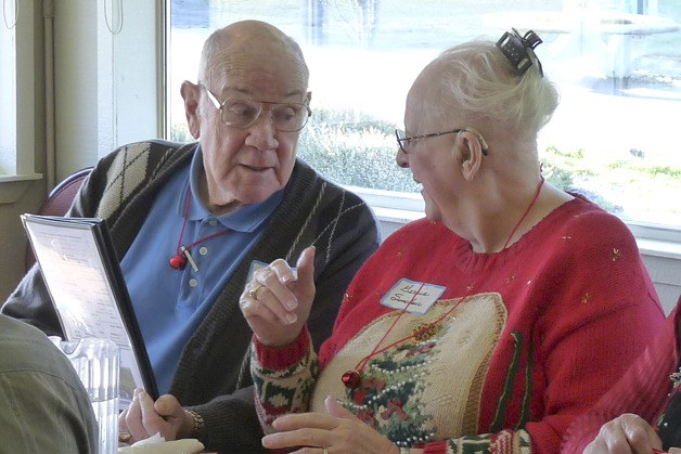 Ross Sugg and Gerrie Sinclair share a smile at a Kitsap Senior event.