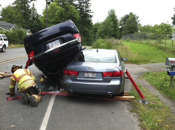 A woman was injured in a rollover crash on Sunday on State Route 104 near Kingston.