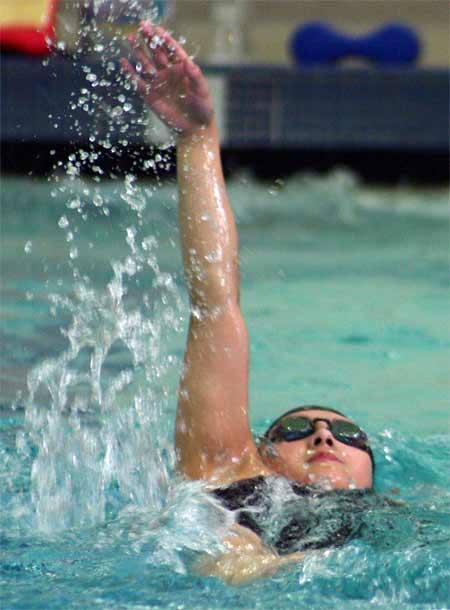 North Kitsap's Bethany Aban works on her backstroke during practice Aug. 30 in the North Kitsap Community Pool.