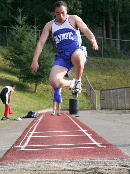 Olympic High School senior David McKennon takes a leap in the long jump event during a league meet Tuesday at Silverdale Stadium.