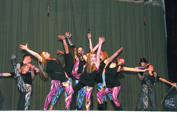 The iiT Factor teen group performs to a mash-up of Journey’s classic rock hit “Don’t Stop Believin’ ” and Lady Gaga’s “On the Edge” at the debut show in Port Orchard Dec. 17.