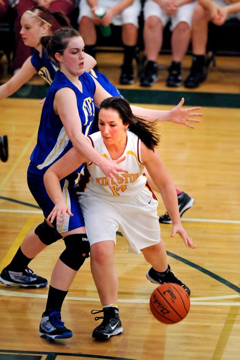 Kingston High's Crystal Hart dribbles against Fife's Ciara Pedroni Wednesday during the Buccaneers' district playoff game in Tacoma.