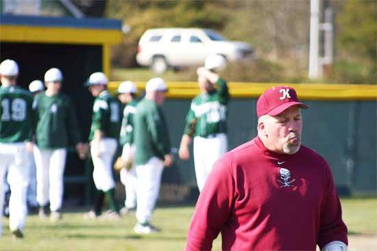 Kingston’s Scott McKay walks away from the pitching mound after listening to Port Angeles  coach Bob Withrow argue with the referee during an Olympic League game in the 2011 season.