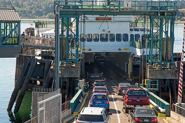 Foot passengers and motorists board the Sealth ferry at the Bremerton Ferry Terminal for the 9:45 a.m. sailing July 29.