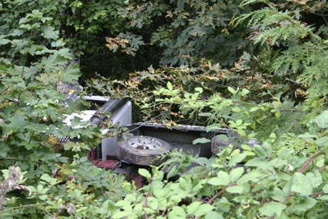 A truck came to rest in an ditch about 20 feet off State Route 305 Monday afternoon after hitting the guardrail and driving off the road. The truck hit a power pole and burst into flames.