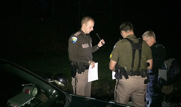 Kitsap County Sheriff’s Office detectives investigate the scene of a domestic dispute in which a man died March 22.