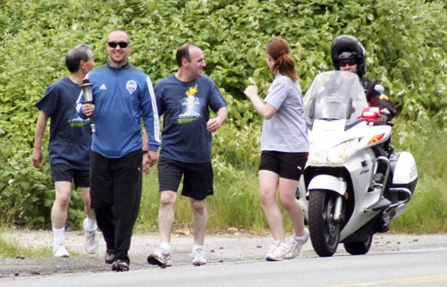 Members of Kitsap County law enforcement carried the Flame of Hope through Port Orchard on Thursday afternoon.