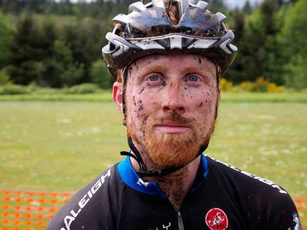 Seattle's Craig Etheridge shows off his badges of mud May 10 after he finished the Stottlemeyer 60-mile mountain bike race. Etheridge finished second in the singlespeed category