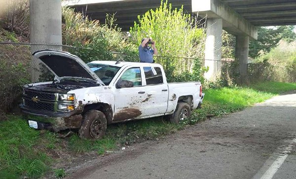 A crashed truck sits on Erlands Point Road NW on March 27. According to the Washington State Patrol