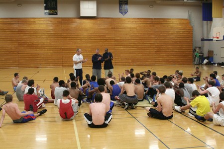 New Bremerton head coach Darren Bowden (center) leads the opening boys basketball tryout alongside assistant coach Shaun Diggs (right) and volunteer Phil Olwell (left).