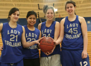 (Left to right) Olympic High School girls basketball starters Brooke Jordan