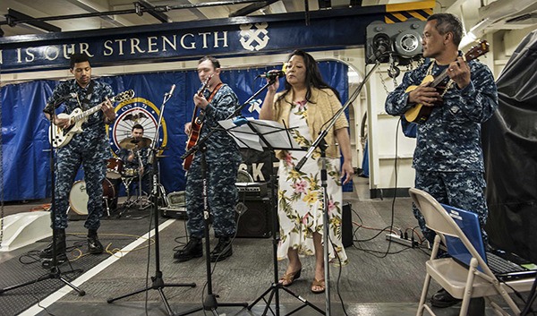 Sailors aboard Nimitz-class aircraft carrier USS John C. Stennis (CVN 74) perform traditional music from the islands of Guam during the Asian American and Pacific Islander Heritage Month ceremony in the ship's forecastle. Stennis is currently undergoing a Docking Planned Incremental Availability maintenance period at Puget Sound Naval Shipyard and Intermediate Maintenance Facility.