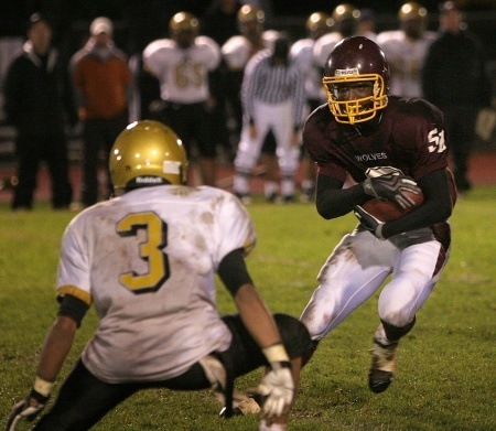 South Kitsap wideout Isaiah Davis jukes a Lincoln defender during the Wolves blowout win on Friday night.