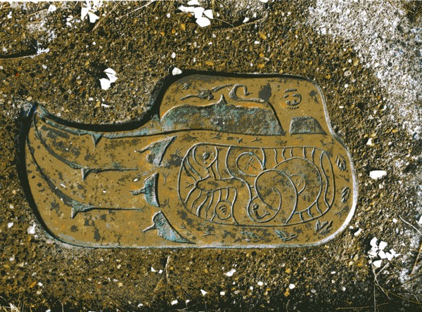 This very detailed carving mounted in concrete was found on the bank at the entrance to the slough. Do you know its story? Let us know.