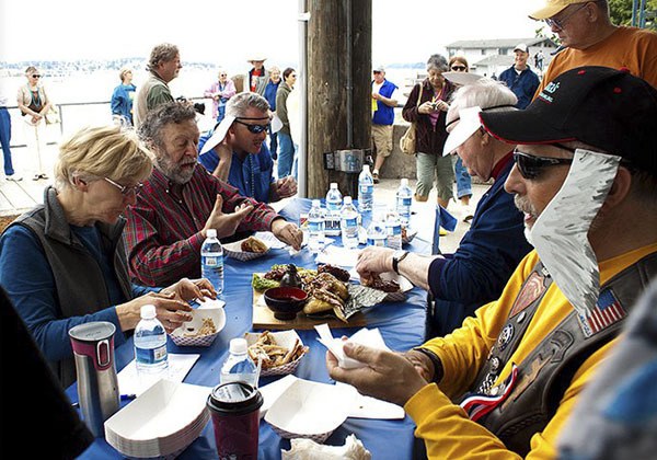 Judges give wings a taste test in the annual Seagull Calling Contest wings cookoff