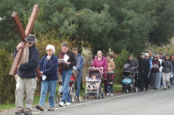 About 30 people gathered Friday morning for the the 22nd Annual Port Orchard Good Friday Cross Walk. The walk began on Mitchell Road and ended on Bay Street in downtown.