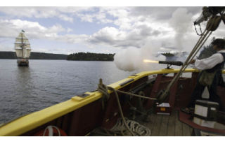 Lady Washington gunner Roscoe Washcher fires off one of the guns located on the Lady Washington at the Hawaiian Chieftain last year near the Port of Brownsville.