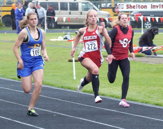 Bremerton’s Christine Foresha runs in a 100 meter heat.