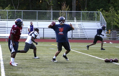 Kitsap Bears quarterback Don Purser gets ready to throw a pass Wednesday at practice at Kingston High School.