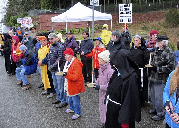 Activists from Ground Zero Center for Nonviolent Action block the main gate at Naval Base Kitsap-Bangor in an act of civil resistance to nuclear weapons