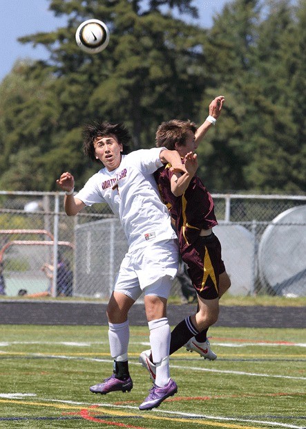 North Kitsap's Jonah Stickney and White River's Travis Morris collide during first round of the West Central District tournament May 12 at North Kitsap High School Stadium. North Kitsap lost 1-0 in overtime.