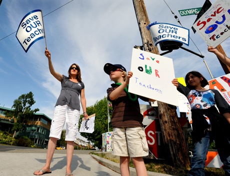 JoEllen and Declan O’Reilly joined fellow supporters of the Save Our Teachers campaign on the corner of Winslow Way and Olympic Drive on Bainbridge last week.